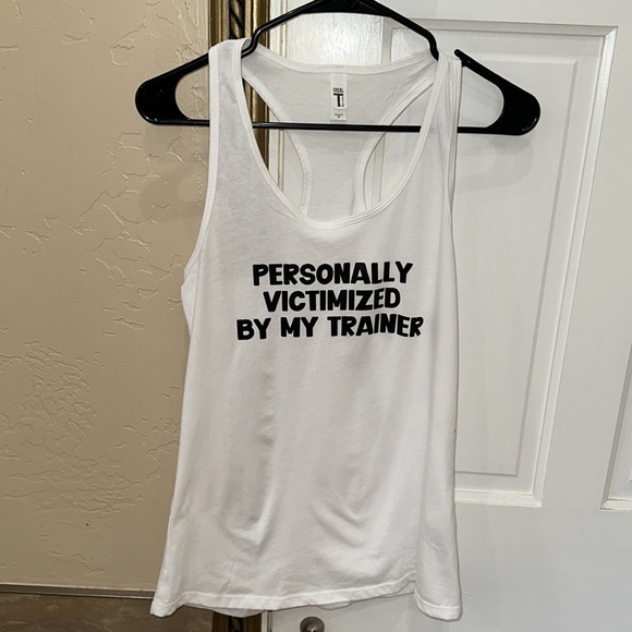 White tank “. Personally victimized by my Trainer”. - Picture 3 of 8